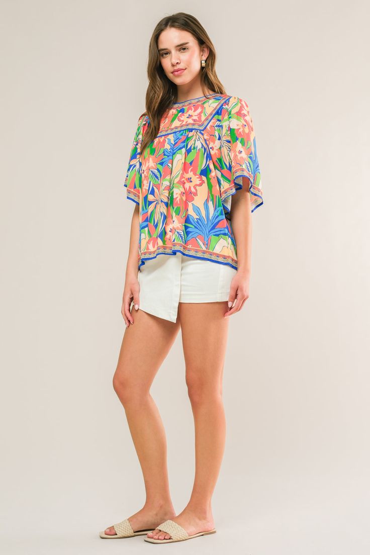 A printed woven top featuring round neckline, short sleeve and back button closure Details: Self : 100% Polyester Size & Fit - Model is 5`8" And Wearing Size Small- Measurements Taken From Size Small- Approx. Length: 25" Spring Patterned Short Sleeve T-shirt, Casual Summer Top With Flutter Sleeves, Casual Summer Short Sleeve Top With Flutter Sleeves, Casual Flutter Sleeve Top For Summer, Summer Floral Print Short Sleeve Crew Neck Top, Summer Floral Print Crew Neck Short Sleeve Top, Vacation Printed Tops With Flutter Sleeve, Spring Short Sleeve Tops With All Over Print, Blue Floral Print Top With Flutter Sleeves