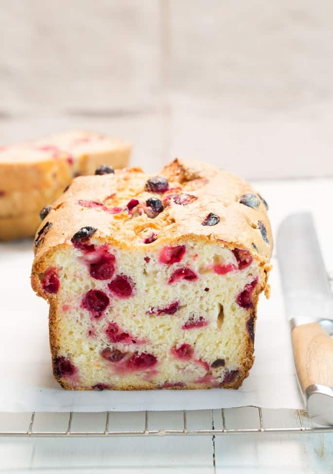 a piece of cake on a plate next to a knife