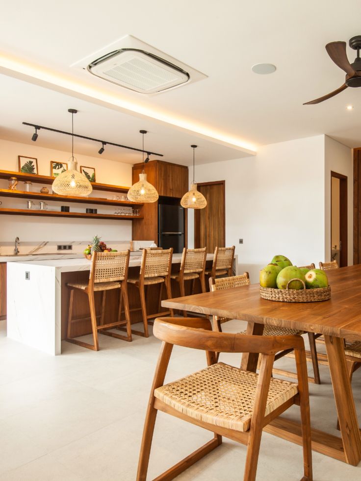 a wooden table sitting in the middle of a kitchen