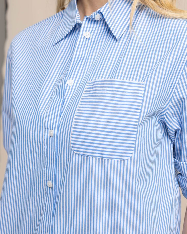 Polished and professional, this long-sleeve button-down gives you timeless style from the boardroom to the boardwalk. Our soft cotton top features a shirt tail hem and button cuffs for a custom fit that's both sophisticated and casual. Style: 10871 Classic Blue Blouse With Shirttail Hem, Blue Shirt With Roll-up Sleeves And Shirttail Hem, Blue Shirt With Button Cuffs And Shirttail Hem, Blue Shirt With Placket And Shirttail Hem, Long Sleeve Dress Shirt With Cuffed Sleeves For Work, Workwear Dress Shirt With Cuffed Sleeves, Spring Dress Shirt With Button Cuffs For Daywear, Spring Office Dress Shirt, Relaxed Fit, Blue Button-up Dress Shirt For Daywear