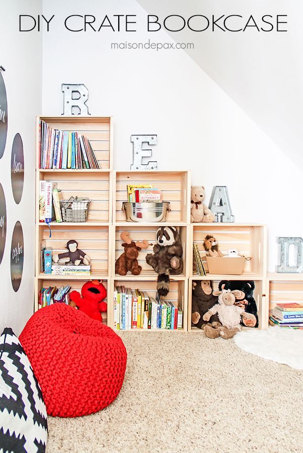 a child's bedroom with teddy bears and bookshelves on the wall, carpeted floor