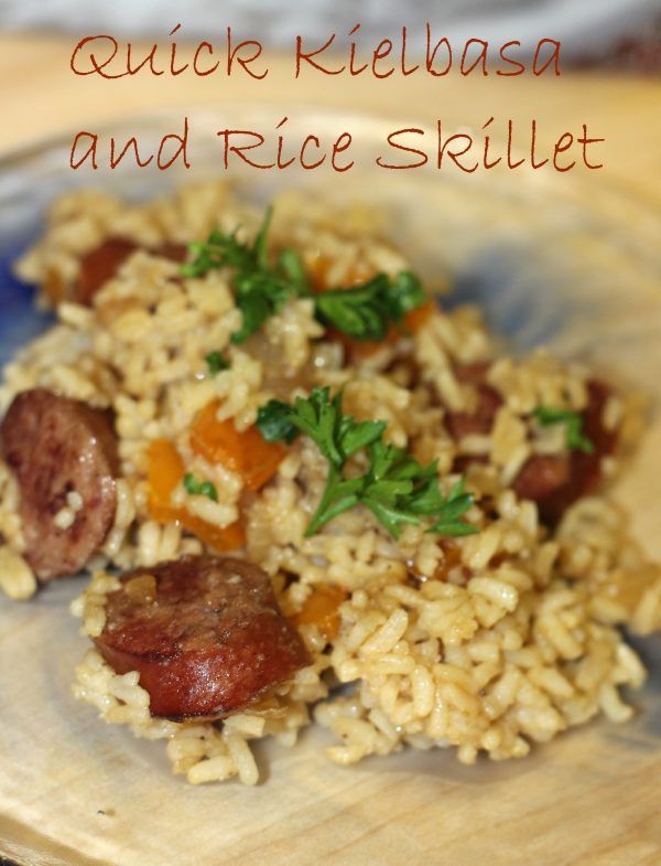 a plate with rice and sausage on it