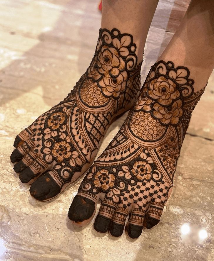 the feet are decorated with henna and flowers