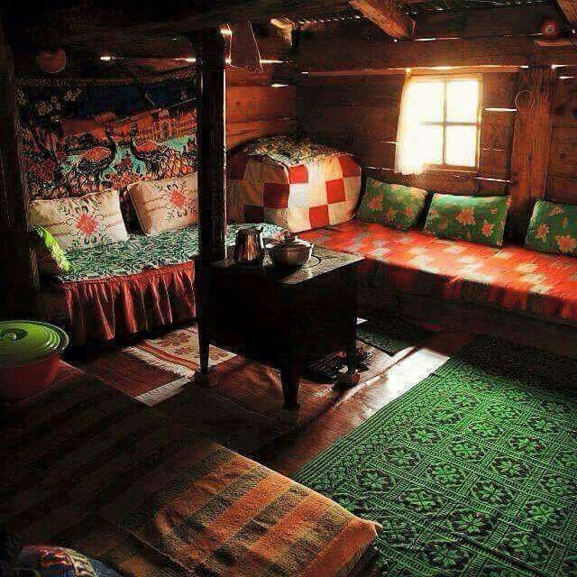 a room with a couch, table and rugs in the middle of it that says boyie guzzle selyer azlayor gitiglie