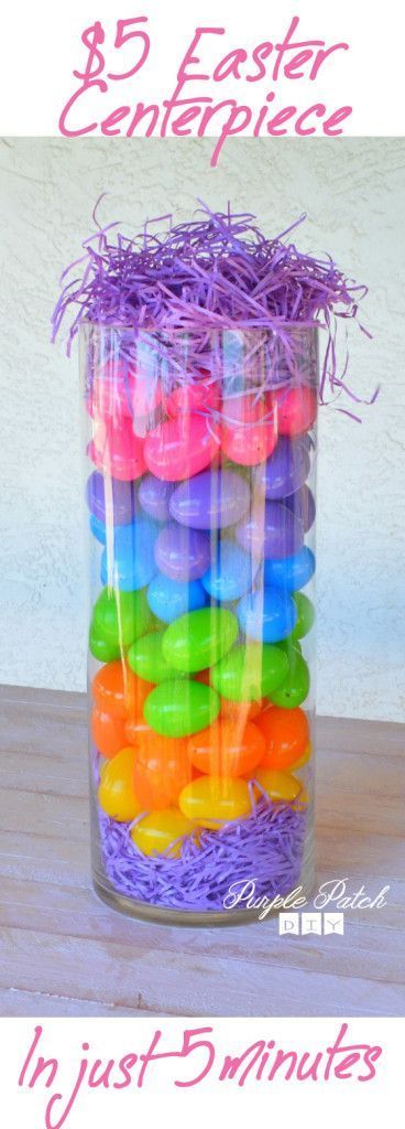 a jar filled with lots of different colored donuts