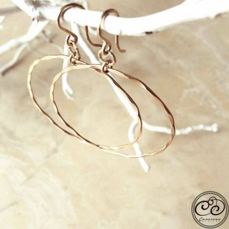 Laurel Hoop Earrings are a unique hoop design when you are wanting a pair of everyday earrings but want a little something special! Available in two sizes. The small hoops have two hammered circles and the large hoops have one circle. Both are highlighted with a diamond cut accent. Features: - Handcrafted from the finest .925 Sterling Silver & Gold fill Hoop design Small design approx. 1.5" long / largest circle size approx. 3/4" round Large design approx. 2.25" long / circle approx. 1 1/2" roun Everyday Small Hoop Hammered Earrings, Hammered Open Circle Hoop Earrings As A Gift, Hammered Open Circle Earrings For Everyday, Hammered Open Circle Hoop Earrings For Gift, Hand Forged Hoop Earrings In 14k Gold Filled, Gift Hammered Open Circle Hoop Earrings, Small Hammered Metal Hoop Earrings, Hand Forged 14k Gold Filled Hoop Earrings, Hammered Metal Circle Hoop Earrings