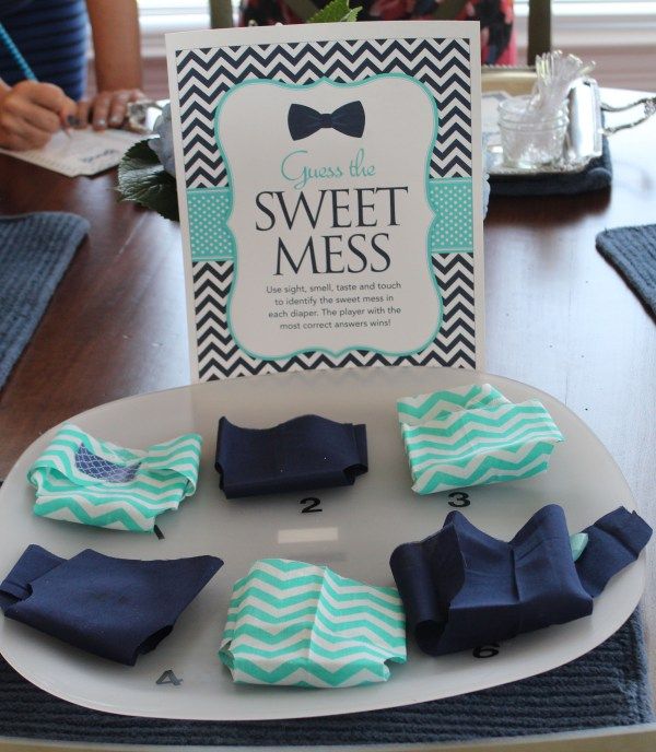 there are several pieces of cloth on the plate and in front of it is a sign that says sweet mess