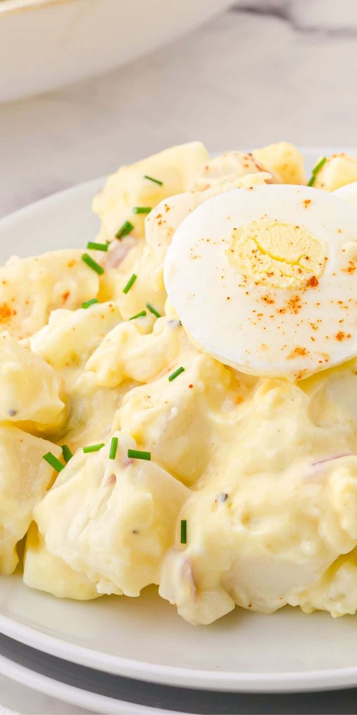 an egg is sitting on top of mashed potatoes