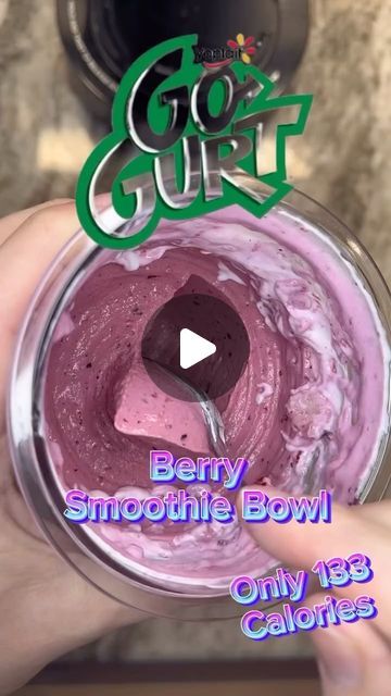 someone is holding a bowl with some food in it and the words berry smoothie bowl only 1g calories