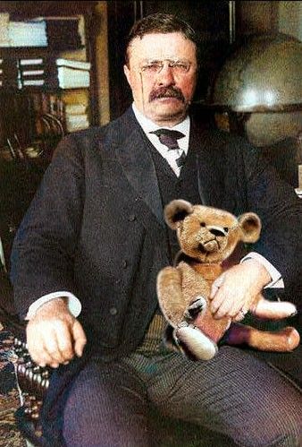 an old black and white photo of a man with a teddy bear in his lap