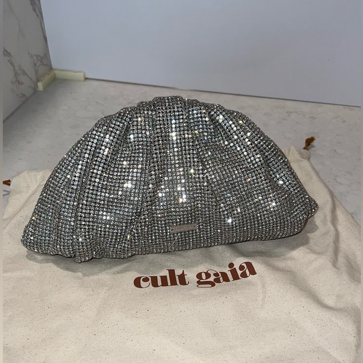 Brand New No Defects ( Check The Pics) Mini Jaala Rhinestone Clutch Bag Silver Tone Logo Plaque Magnetic Fastening Never Been Used, No Defects ( Check The Pictures) Trim: Sheep Leather Lining: Polyester Comes With A Protective Dust Bag & Extra Crystal Just In Case You Need It Cult Gaia Bag, Rhinestone Clutch, Crystal Clutch, Bag Silver, Cult Gaia, Sheep Leather, Just In Case, Sheep, Clutch Bag