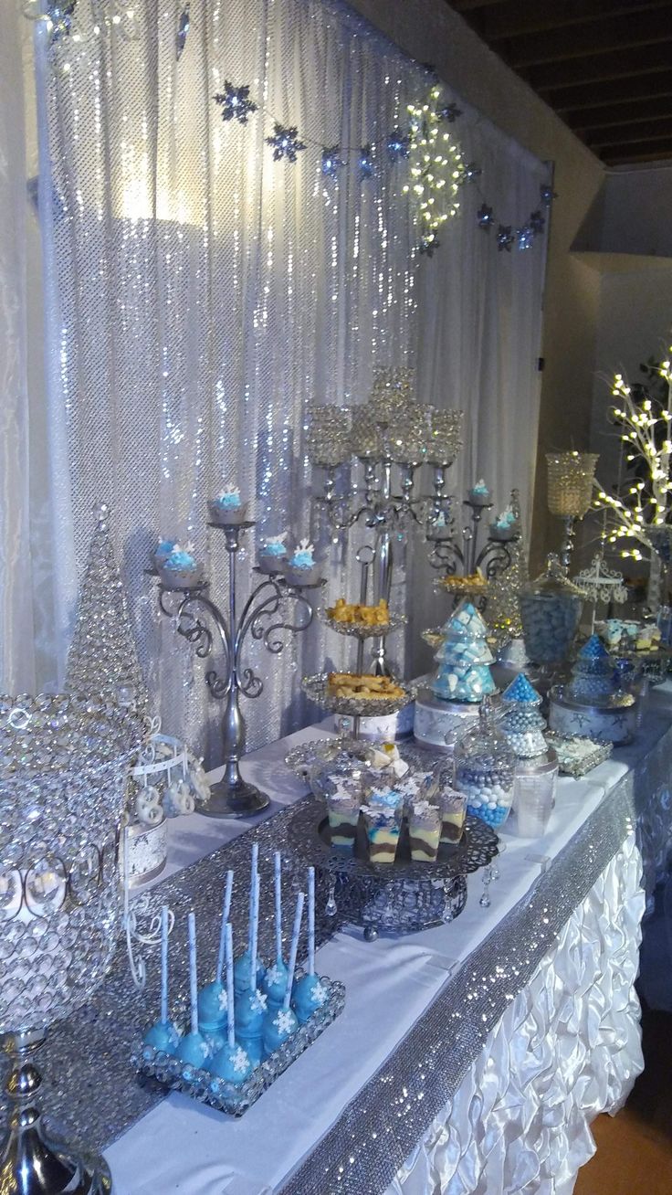 a table topped with lots of cakes and cupcakes