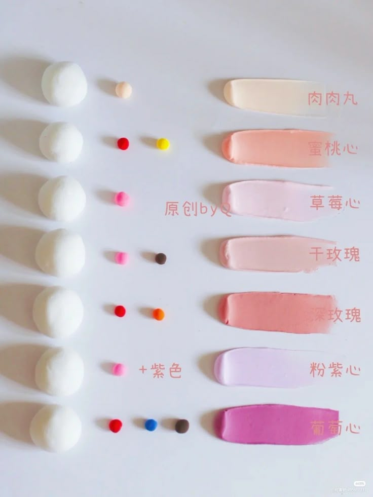 several different colors of toothpaste on a white surface with chinese writing in the middle