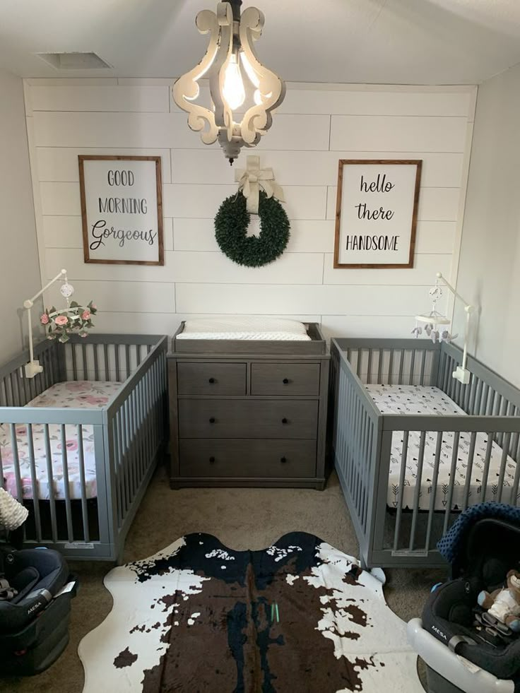 a baby's room with two cribs and a rug on the floor