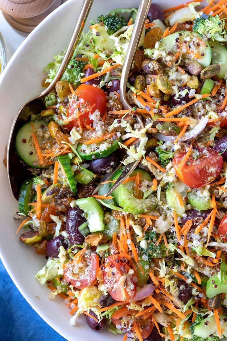 a salad with broccoli, carrots and other vegetables