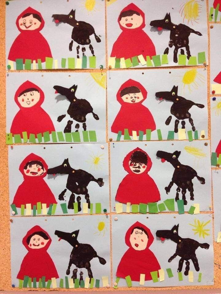 paper cut outs with pictures of children in red coats and black dogs on the ground