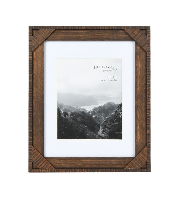 a wooden frame with a black and white photo in the center on a white background