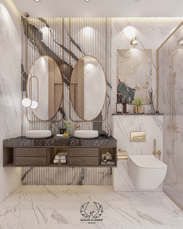 a bathroom with marble walls and two round mirrors on the wall, along with a white toilet