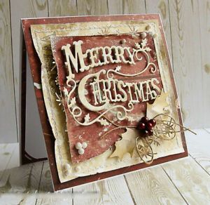 a merry christmas card on a wooden table