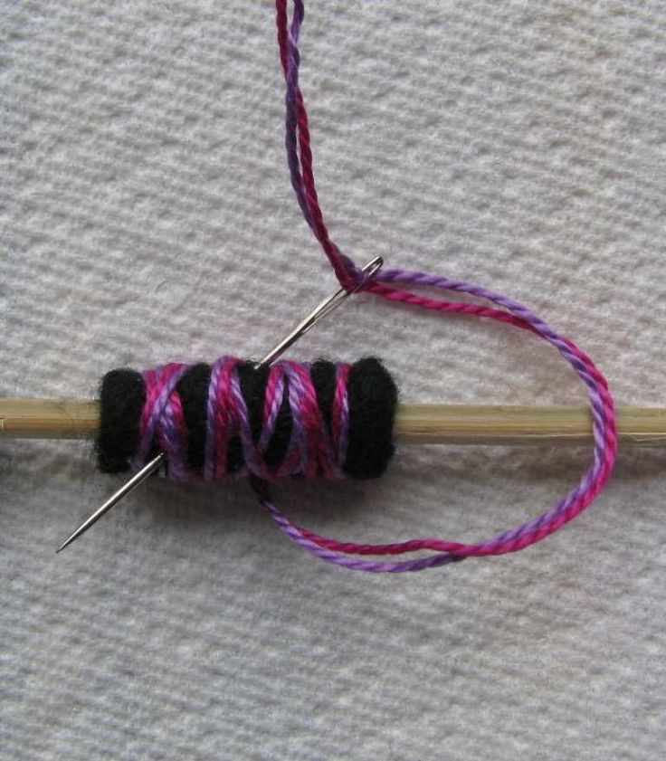 the yarn is being worked on with two needles