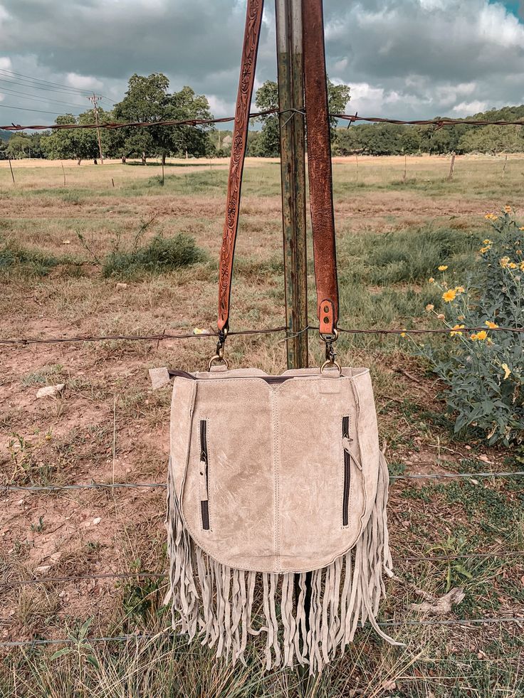 This bag is gorgeous! Zipper closure and concealed carry Measures 12x12x3 With fringe length is 23 Beige Leather Bags With Fringe, Leather Fringe Satchel For Everyday, Everyday Leather Fringe Satchel, Fall Fringe Satchel Bag, Everyday Crossbody Shoulder Bag With Fringe, Everyday Fringe Crossbody Bag, Fall Fringe Shoulder Bag, Fringe Shoulder Bag For Fall, Everyday Fringe Shoulder Satchel