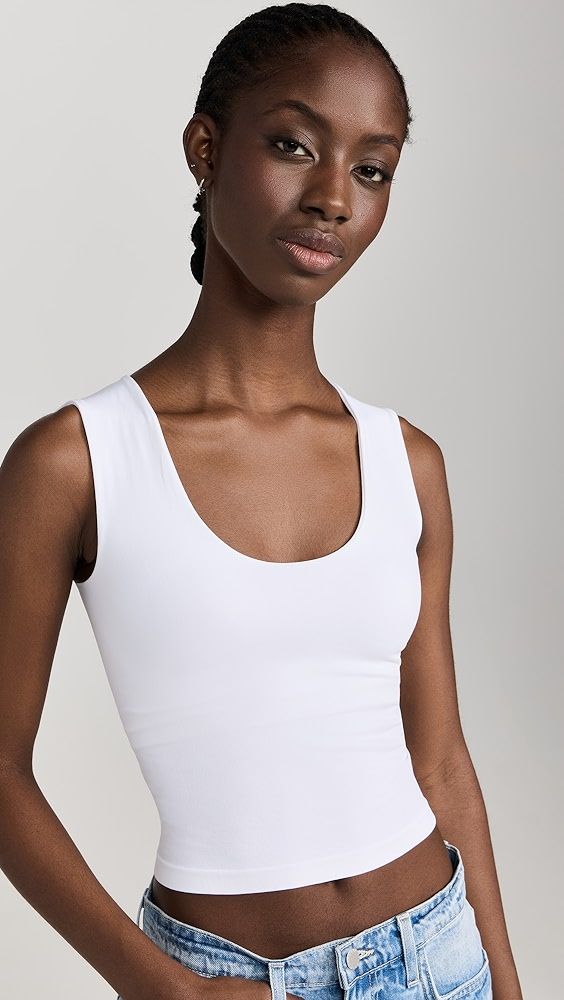 White Scoop Neck Tank Top With Built-in Bra, Fitted Sleeveless Elastane Sports Bra, White Stretch Tank Top With Wide Straps, High Stretch Wide Strap Tank Top, White Fitted Tank Top With Scoop Back, Seamless Scoop Neck Tank Top With Medium Support, Seamless Sleeveless Elastane Sports Bra, Seamless Medium Support Scoop Neck Tank Top, Scoop Neck Tank Top With Light Support