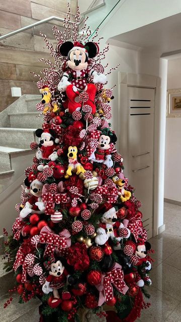 a christmas tree decorated with minnie mouse ornaments