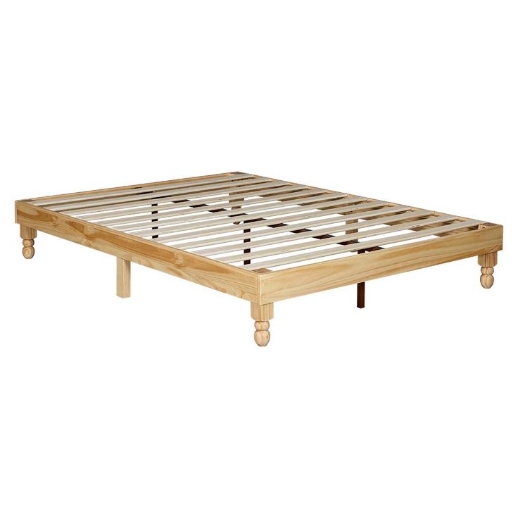 a wooden bed frame with four legs and no headboard on the bottom, in front of a white background