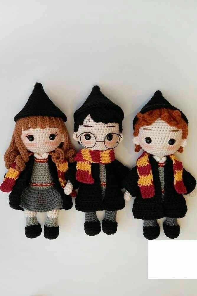 three crocheted harry potter dolls are standing next to each other on a white surface