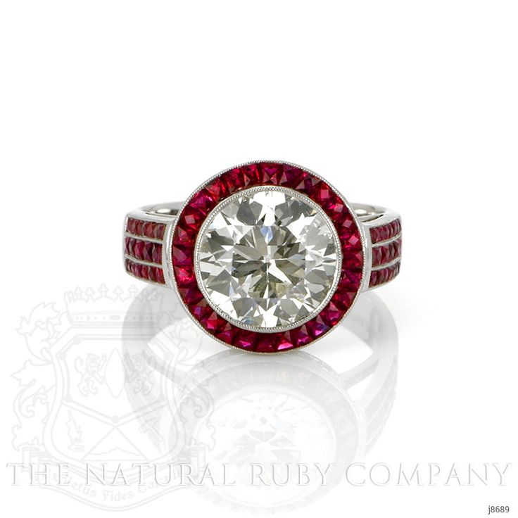 a red and white diamond ring on a white background