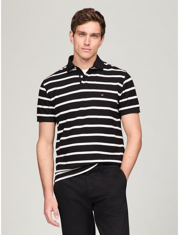 Tommy Hilfiger men's polo. What we do best, the classic polo styled from lightweight performance fabric that wicks away moisture to help keep you cool and dry.  Material: 60% Regenerative Cotton, 40% Polyester Pes. Classic Black Tommy Hilfiger Top, Tommy Hilfiger Sporty Cotton Polo Shirt, Sporty Tommy Hilfiger Collared Polo Shirt, Tommy Hilfiger Man, Performance Fabric, Wicks, Men's Polo, Blue Stripes, Sweater Top