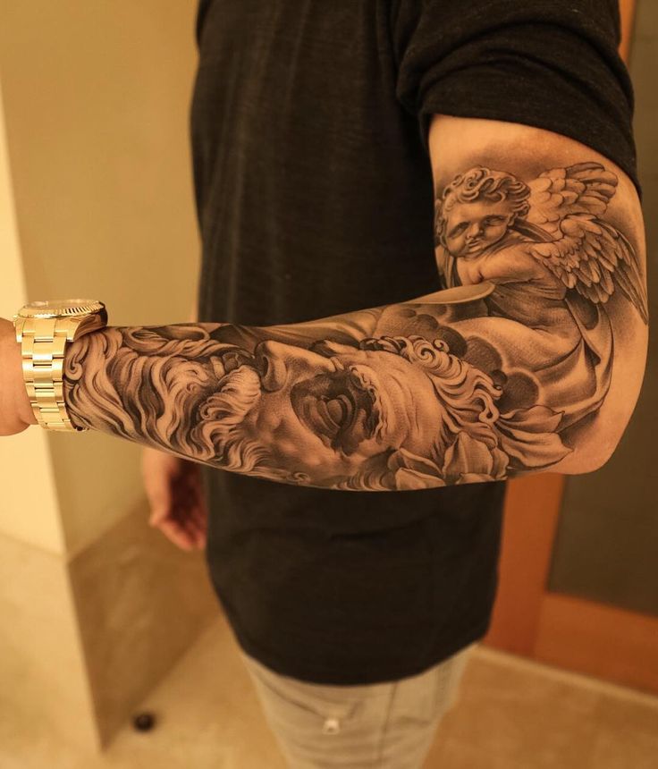 a man with a tattoo on his arm