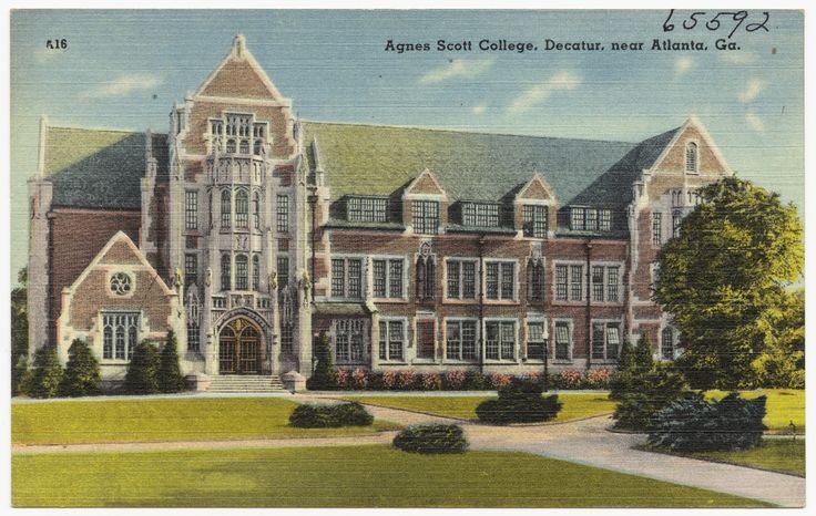 an old postcard shows the front of a large building