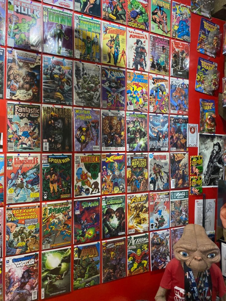 there are many comic books on the wall