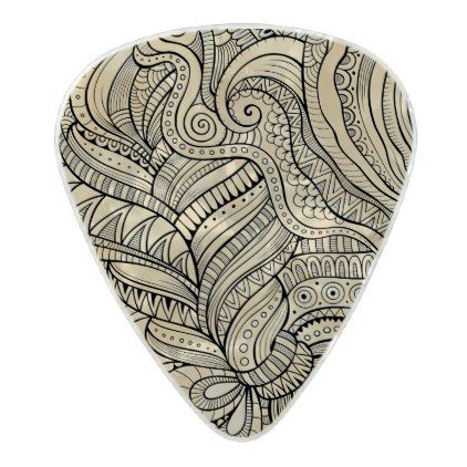 a guitar picker with an intricate design on it