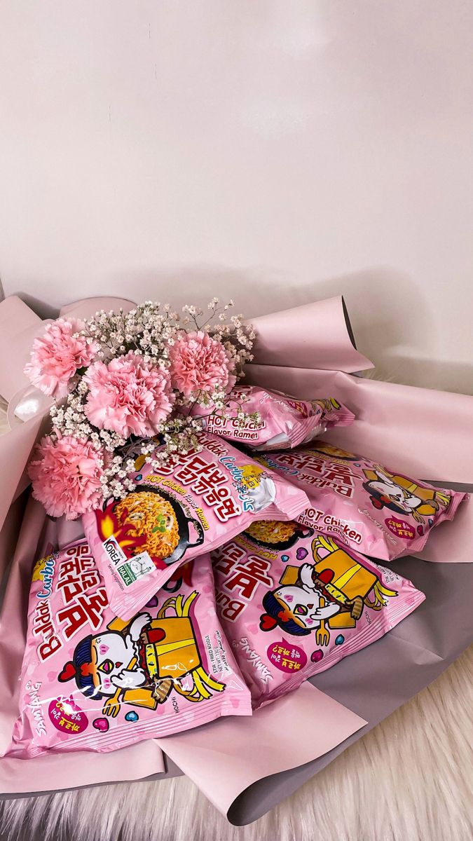 a bouquet of pink carnations and baby's breath candy