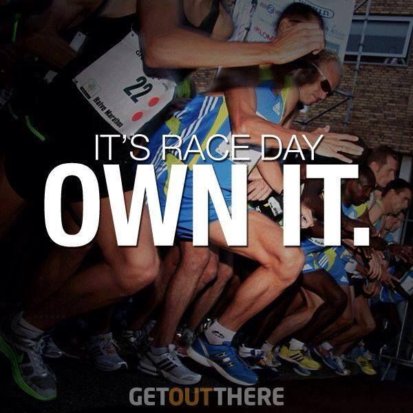 a group of people are huddled together with the words it's race day own it