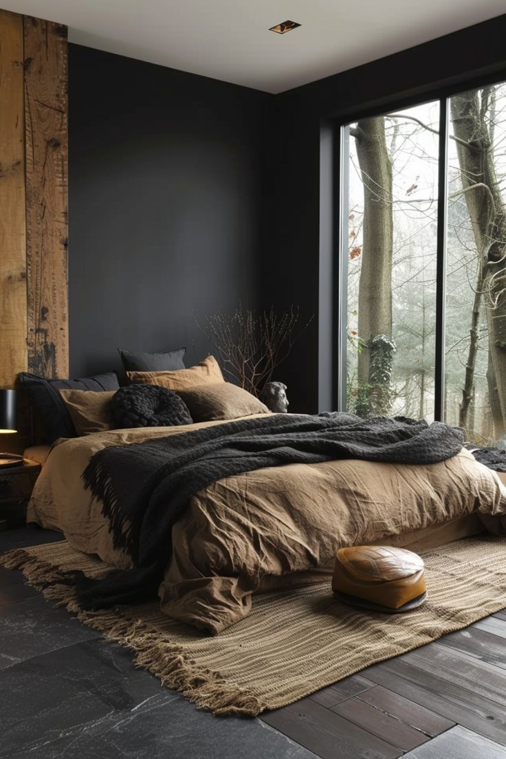 a large bed sitting next to a window in a room with wooden floors and walls