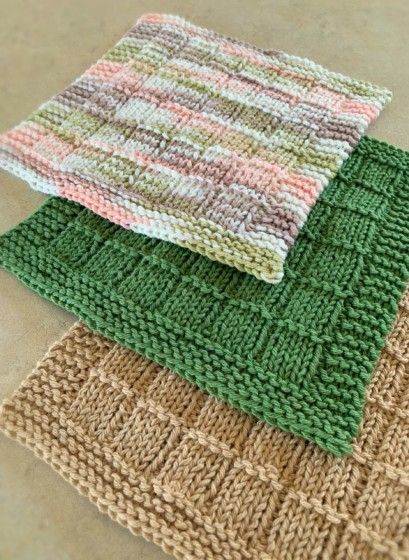 three knitted placemats sitting on top of each other next to each other