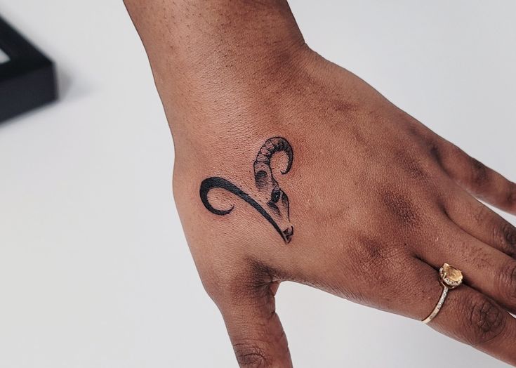 #Aries ♈️ #handtattoos #zodiac #finelinetattoo #minimaltattoo #daintytattoo #greenvillesc #SouthCarolina #tattooartist Rams Tattoo Aries, Ram Finger Tattoo, Men’s Aries Tattoo, Aries Sign Tattoo For Women, Mens Aries Tattoo, Aries And Taurus Tattoo Together, Simple Aries Tattoo Design, Aries Tattoo On Hand, Tattoo Ideas Female Meaningful Aries