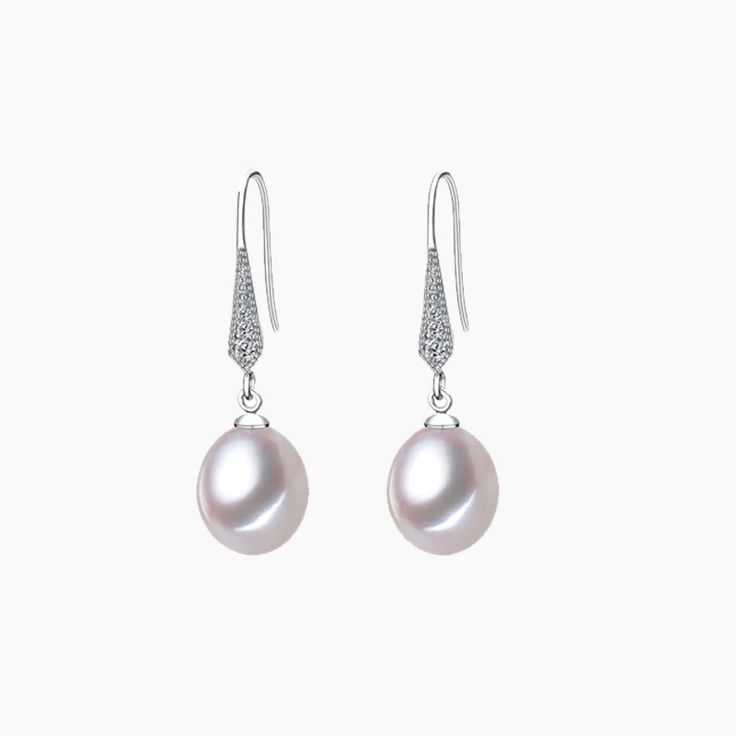 The Pearl 925 Silver Drop Earrings epitomize sophistication and grace with their timeless design and exquisite craftsmanship. These earrings marry the natural elegance of pearls with the lustrous beauty of sterling silver, creating a harmonious union of classic and contemporary style. Elegant Pearl White Earrings With Pearl Drop, Elegant Pearl White Pearl Drop Earrings, Classic Sterling Silver Pearl Drop Earrings, Classic Sterling Silver Drop Pearl Earrings, Graceful Pearl White Earrings For Formal Occasions, Classic Sterling Silver Pearl Pendant Earrings, Elegant Pearl Pendant Earrings, Silver Akoya Pearl Dangle Earrings, Graceful Pearl Earrings For Formal Occasions