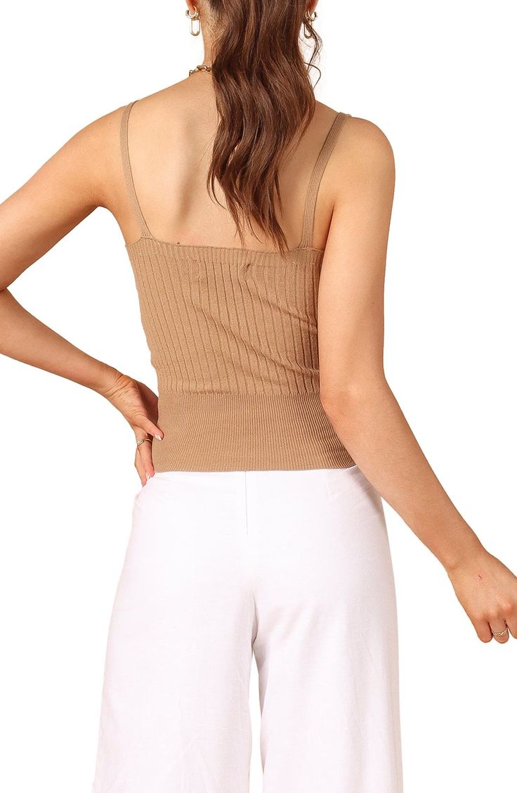 Effortlessly chic whether layered or solo, this V-neck tank is knit in a slinky rib stitch in a fitted silhouette. V-neck 45% polyester, 32% viscose, 23% nylon Hand wash, dry flat Imported Summer Ribbed Beige Crop Top, Summer Beige Ribbed Crop Top, Beige Ribbed V-neck Top, Beige Fitted V-neck Camisole, Chic Beige Tops With Tank Straps, Summer V-neck Crop Top For Layering, Fitted Ribbed Tank Top For Layering, Fitted Beige Knit Tank Top, Brown Camisole With Tank Straps For Spring