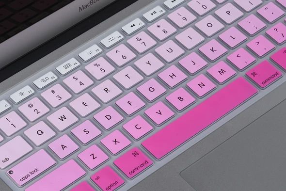 a keyboard with pink keys on it