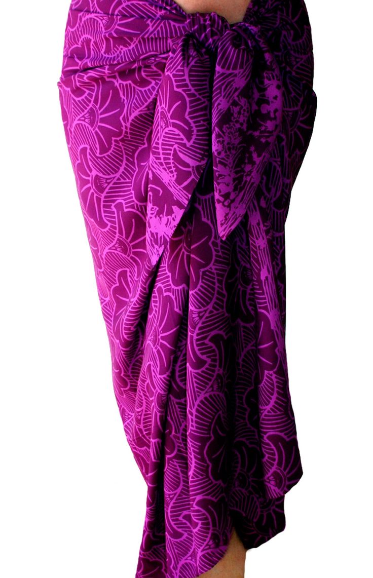 a woman is wearing a purple skirt with an intricate design on the front and side