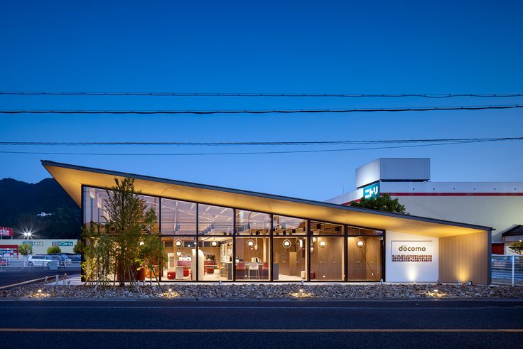 a modern building is lit up at night