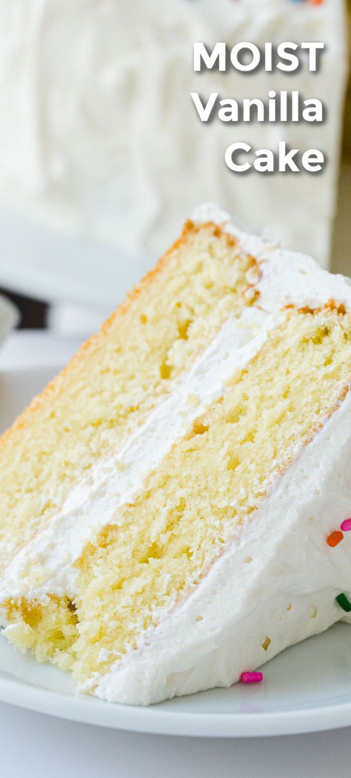 a slice of vanilla cake with white frosting and sprinkles on a plate