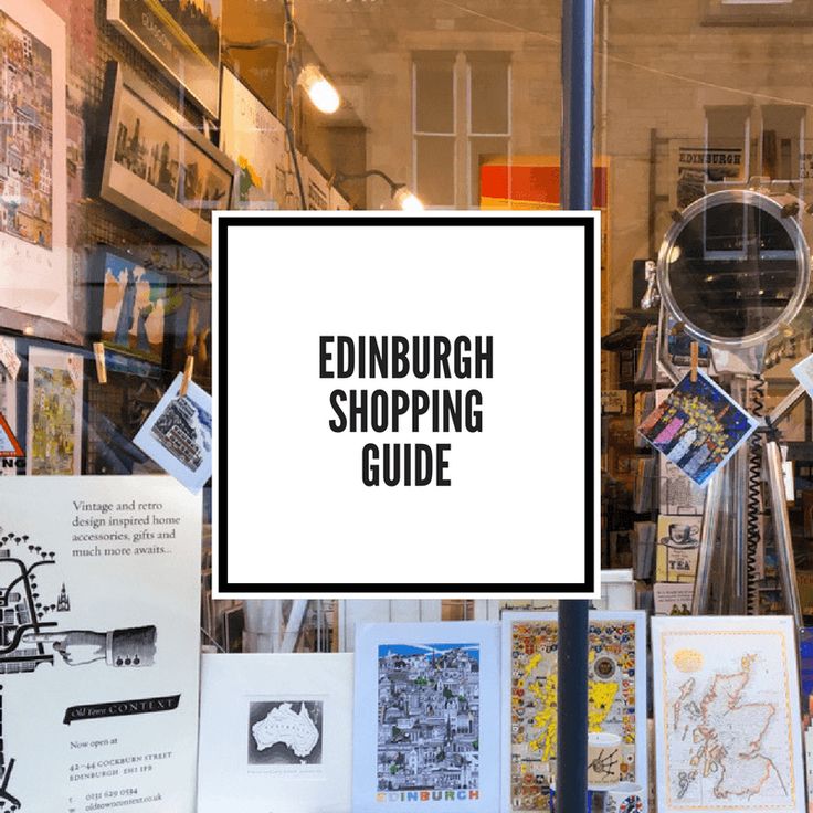 the edinburgh shopping guide is displayed in front of a store window with posters and pictures on it