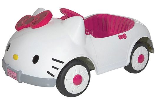 a hello kitty ride on toy car with pink wheels and bow accenting the top