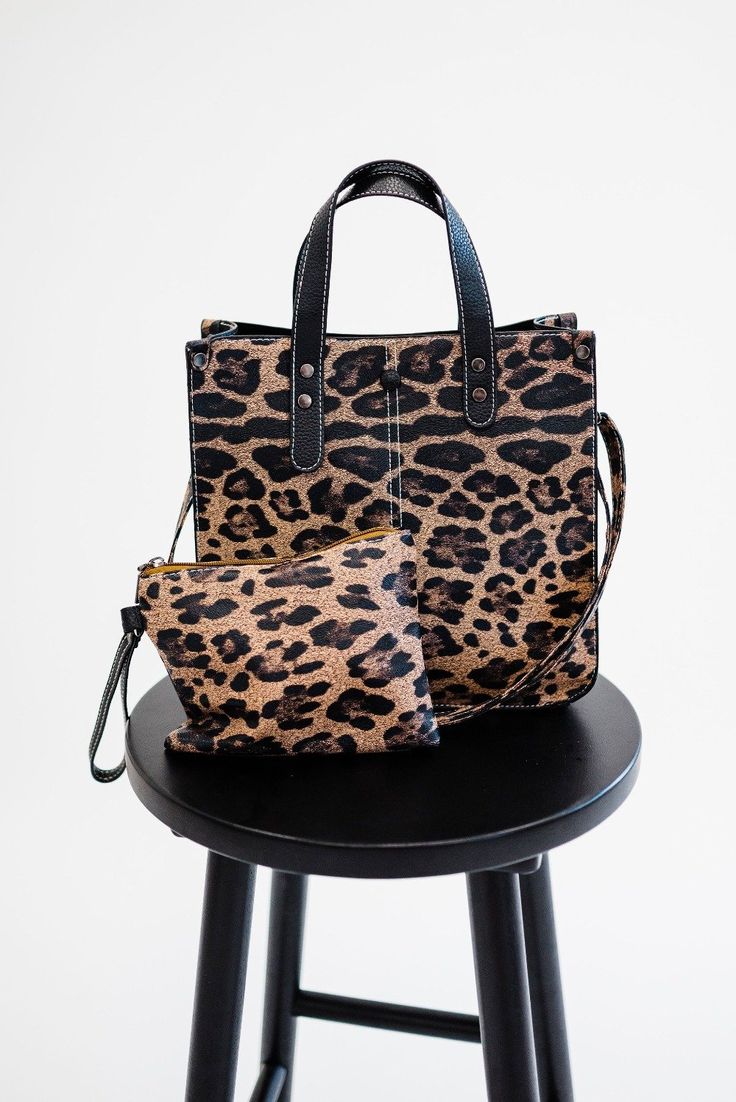 the only thing better than a brand-new purse? a purse that comes with a matching clutch! our livy shoulder bag and clutch is what your animal print accessory dreams are made of. this structured, stylish bag features: three interior pockets a top zipper to keep everything inside secure a detachable crossbody strap a wristlet clutch to wear on its own or toss in your bag to keep things organized the livy is made from soft vegan leather that is both durable and easy to keep clean. and because we kn Leopard Print Large Capacity Satchel Bag, Large Capacity Leopard Print Satchel Shoulder Bag, Leopard Print Large Capacity Satchel Shoulder Bag, Leopard Print Travel Bag With Animal Design, Leopard Print Shoulder Bag With Animal Design, Trendy Leopard Print Tote Bag, Leopard Print Tote Shoulder Bag For Shopping, Everyday Satchel Bag With Animal Design, Leopard Print Bag With Animal Design For Everyday