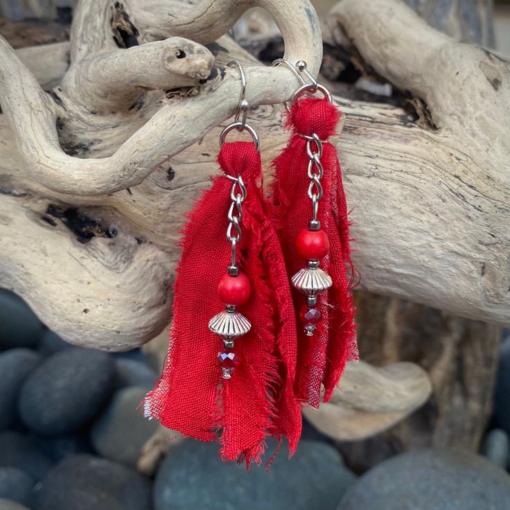 "These beautiful boho inspired earrings are hand-crafted using recycled sari silk and a variety of glass and seed beads.  They are very lightweight and the perfect addition for a casual day or fun night on the town Materials: Sari Silk/Glass, Wood & Metal Beads/Nickel Free Earwire Color: Red Measurements: Drop length approx. 2 3/4\"/Tassel 2\" Weight : 1 gram/.07 oz. (individual earring) Designer: Norma Patridis *Each set of earrings comes boxed ready for gifting* Please note that color may slig Recycled Sari Silk, Sari Silk, Earrings Red, Fabric Jewelry, Metal Beads, Wood Metal, Tassel Earrings, Designer Earrings, Jewelry Earrings Dangle